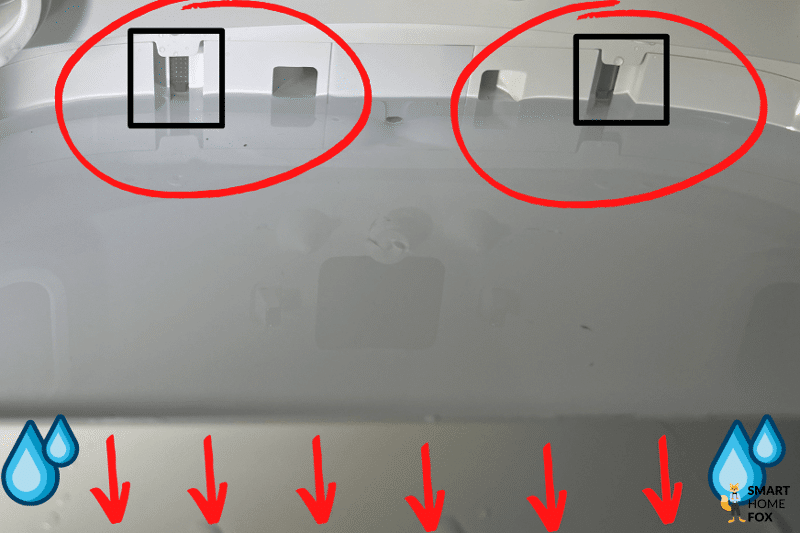 The electrical contacts that measure water level in the base station are circled in red.